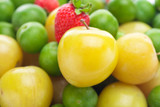 background of green and yellow plum and strawberry