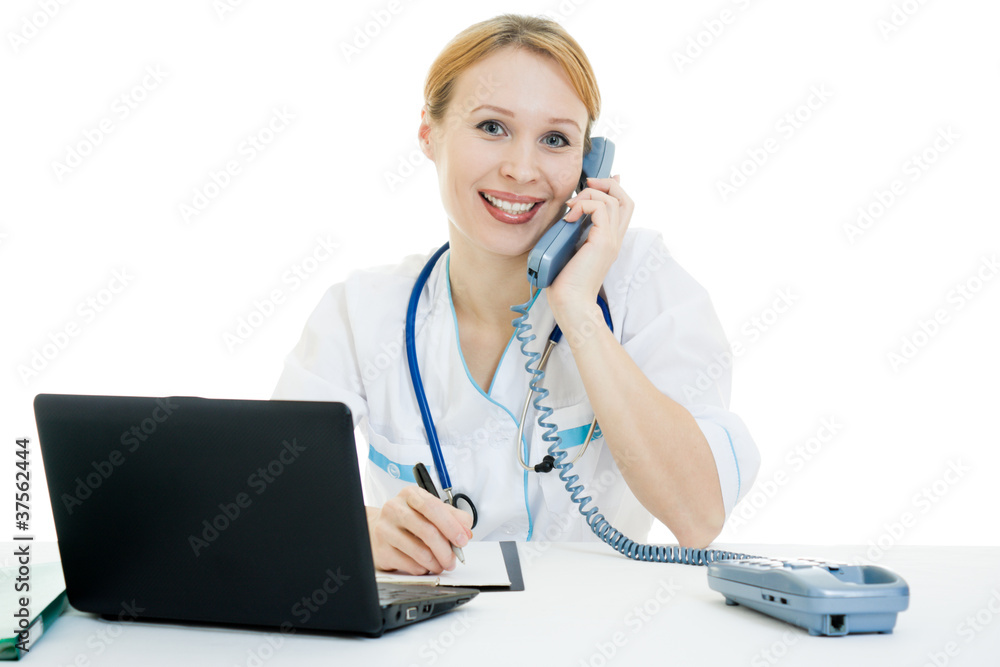 A woman doctor consultant with a laptop on a white background. A woman doctor consultant with a laptop on a white background.