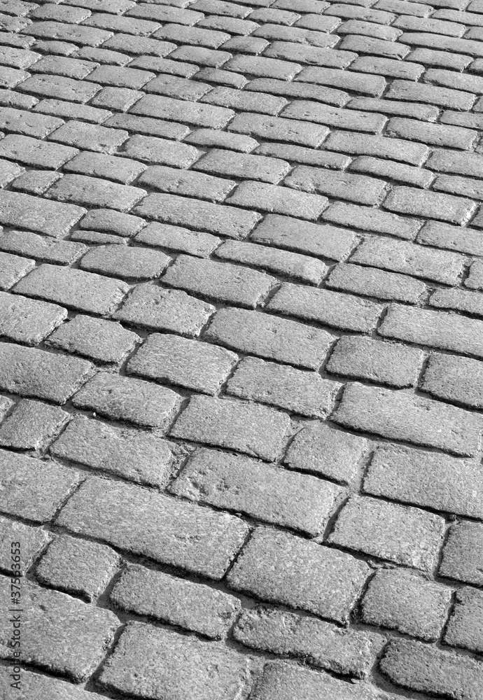 Old English cobblestone road close up.