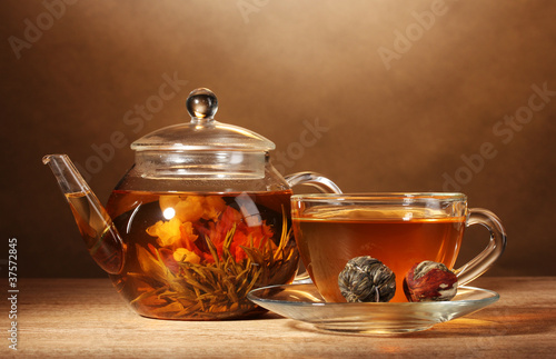 glass teapot and cup with exotic green tea