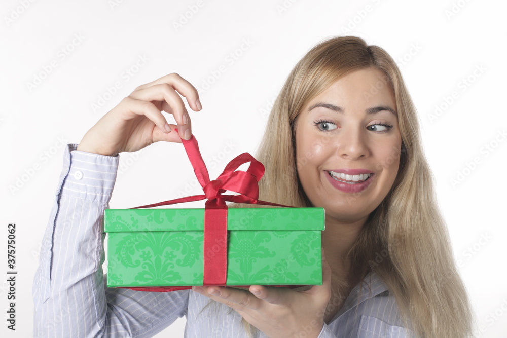 A young woman looks forward with the gift A young woman looks forward with the gift