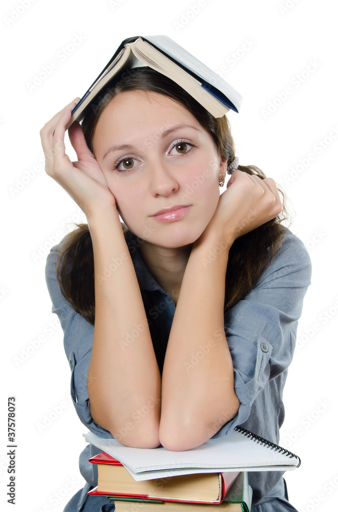 The beautiful girl with books isolated on white The beautiful girl with books isolated on white