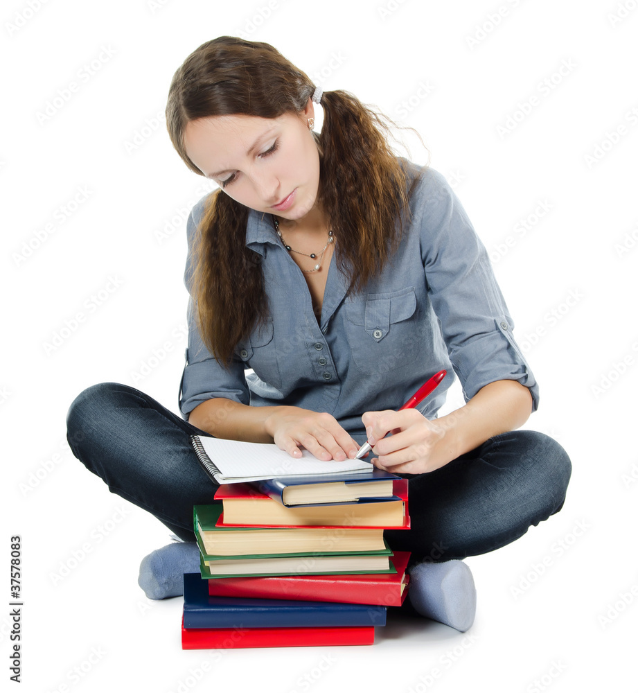 The beautiful girl with books isolated on white The beautiful girl with books isolated on white