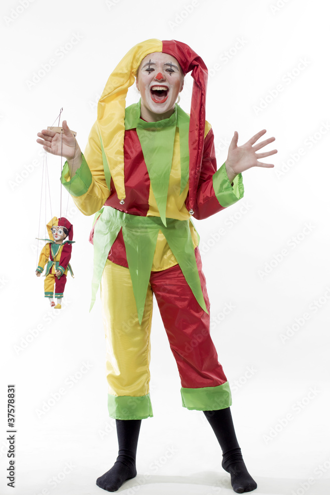 The girl in a suit of the clown holds a doll and shouts