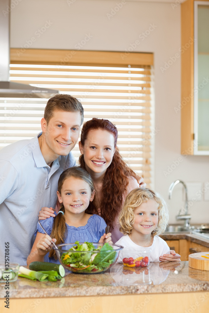 Family standing in the kitchen