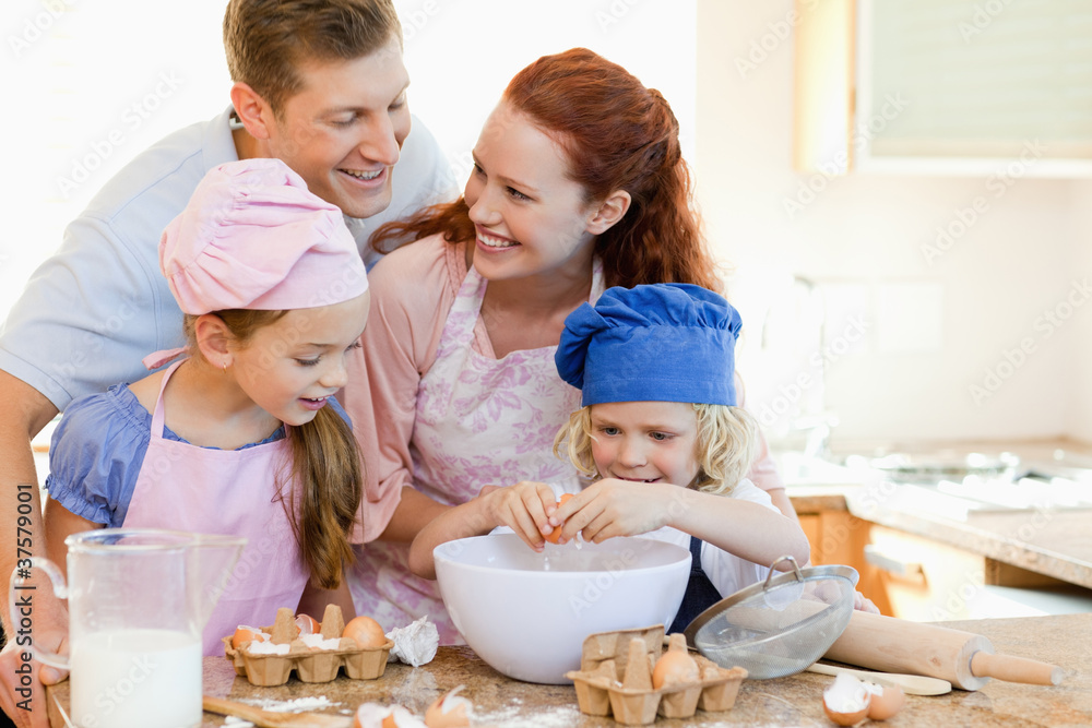 Happy family enjoys baking together Happy family enjoys baking together