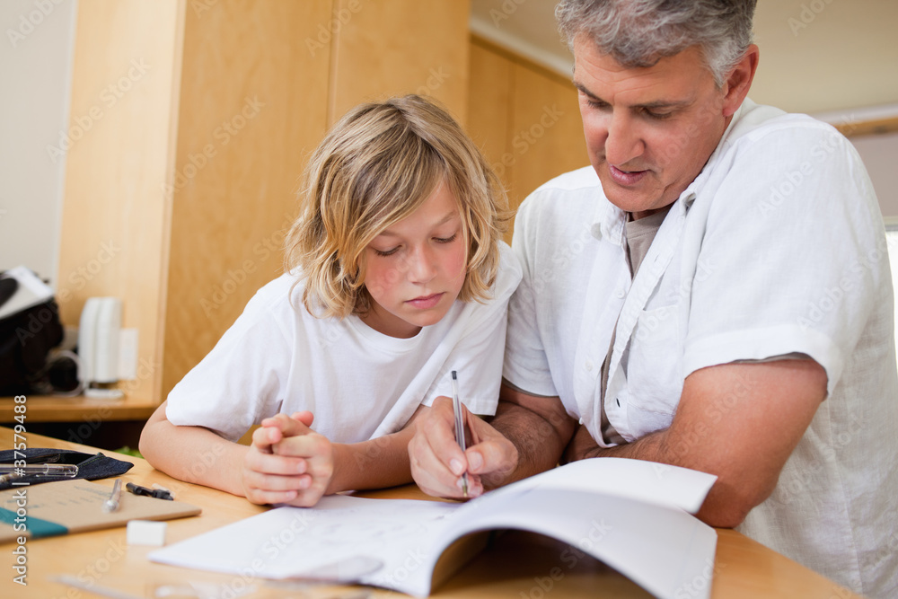 Boy gets help with his homework Boy gets help with his homework