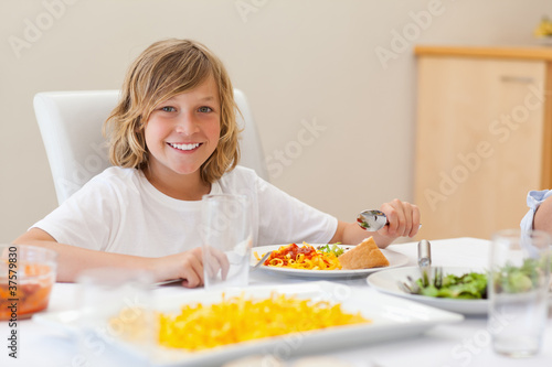 Smiling boy at the dinner table