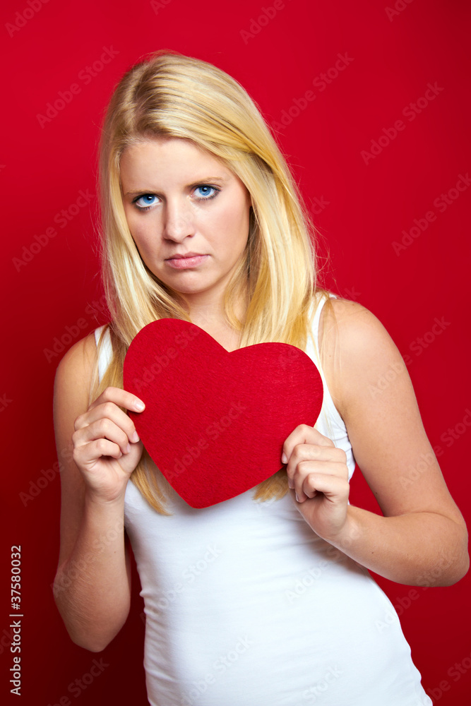 young disappointed woman with a heart young disappointed woman with a heart