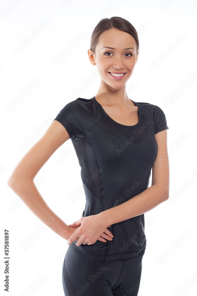 Young happy woman in sports wear isolated on white Young happy woman in sports wear isolated on white