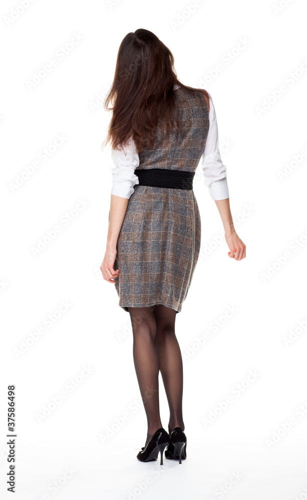 Attractive young brunette, full length portrait, rear view Attractive young brunette, full length portrait, rear view