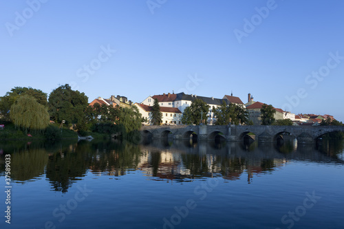 old stone bridge at pisek, czech republic, in the late afternoon © liquid studios