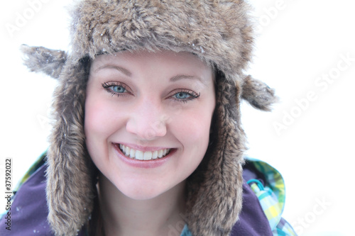 beautiful woman outside in trapper hat photo