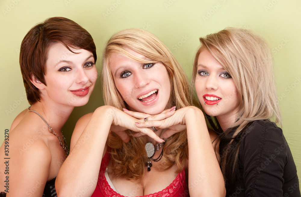Three attractive teen girls smile for a portrait Three attractive teen girls smile for a portrait