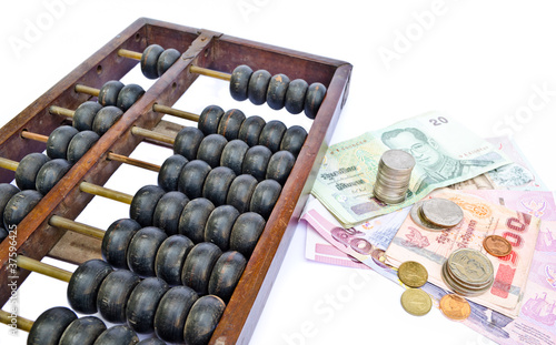 Abacus and Thailand's money on white background
