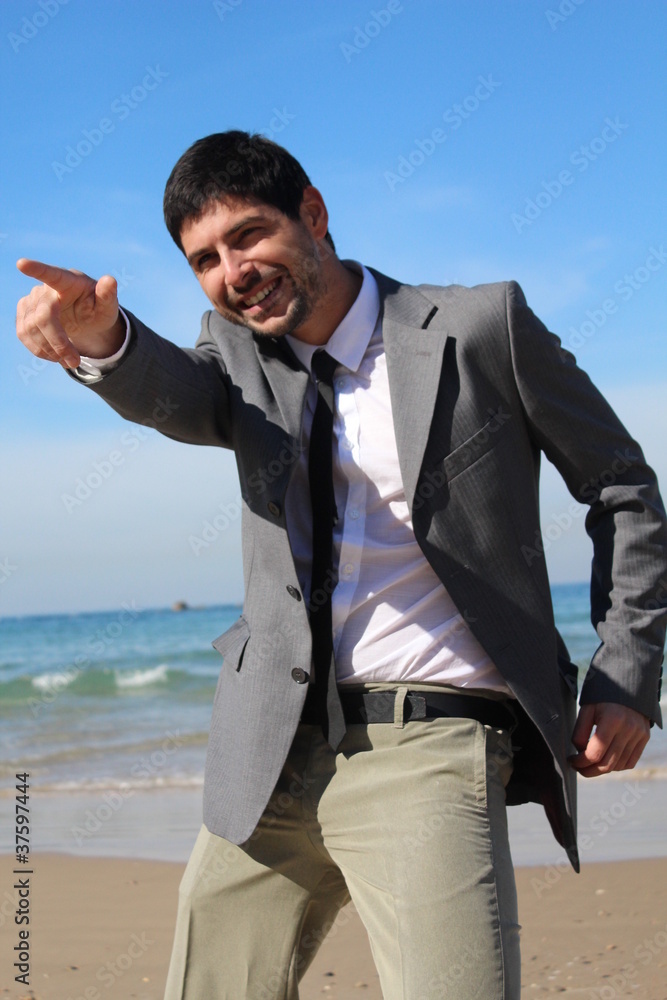 A young businessman pointing his hand like a gun A young businessman pointing his hand like a gun