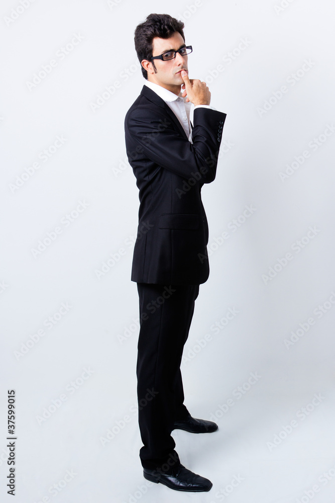 portrait of attractive young business man with reading glasses portrait of attractive young business man with reading glasses