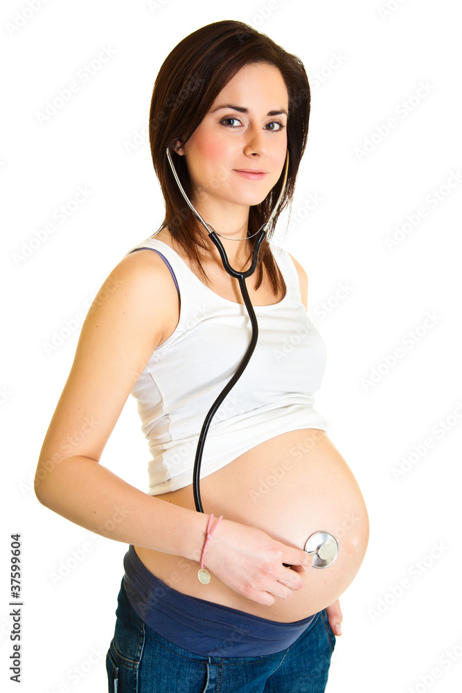 Pregnant woman examining belly with stethoscope isolated Pregnant woman examining belly with stethoscope isolated
