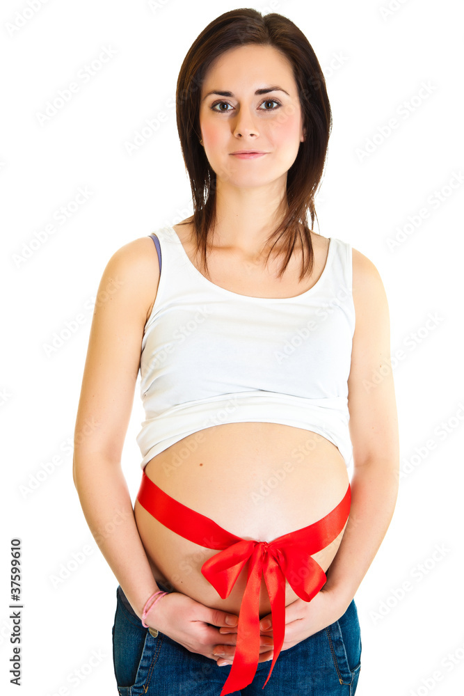 Brunette pregnant woman with red ribbon isolated on white Brunette pregnant woman with red ribbon isolated on white
