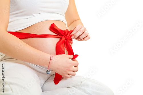 Wallpaper Mural Brunette pregnant woman with red ribbon isolated on white Torontodigital.ca