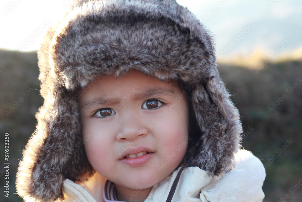 Wonderful portrait of a little child with fur hat Wonderful portrait of a little child with fur hat