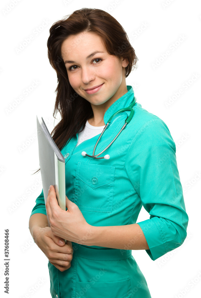 Young attractive woman wearing a doctor uniform Young attractive woman wearing a doctor uniform