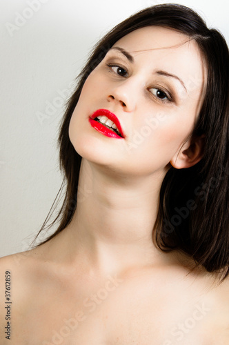 oung fashion model with white skin and red lipstick