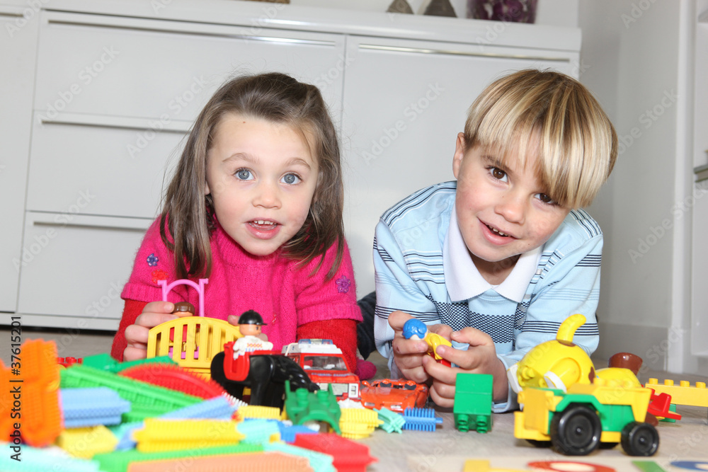 Brother and sister playing with toys Brother and sister playing with toys