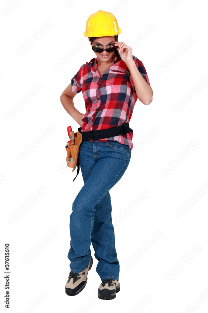 sexy woman in craftsman overalls wearing sunglasses sexy woman in craftsman overalls wearing sunglasses