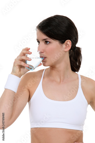 woman drinking water in the gym