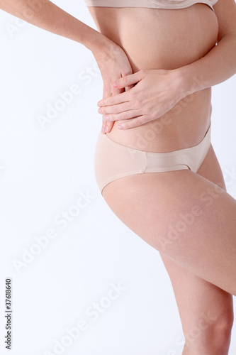 Closeup on woman's back hurting © goodluz