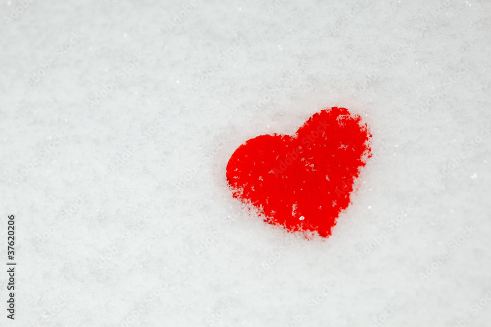 red heart on the snow