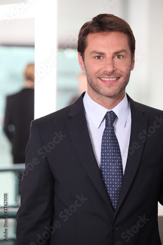 Closeup of a smiling man in agency