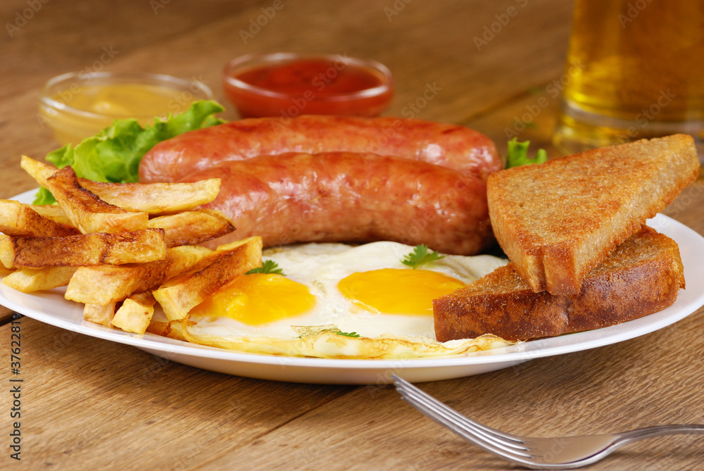 Fried eggs with sausages Fried eggs with sausages