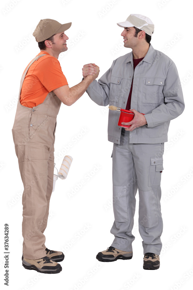two craftsman painters shaking hands two craftsman painters shaking hands