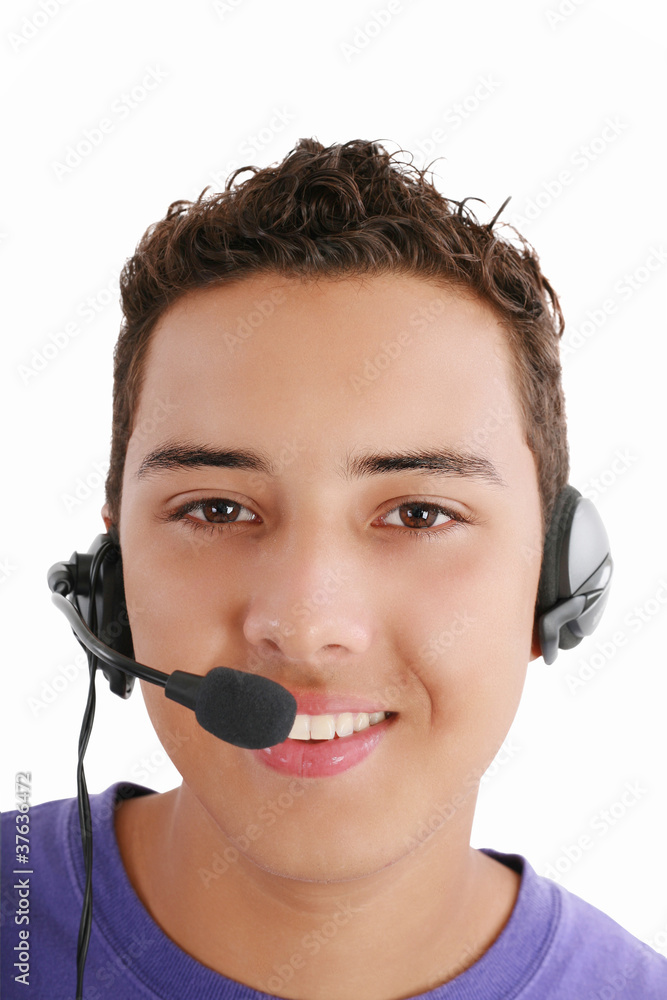 Smiling young man with telephone headset isolated on white backg Smiling young man with telephone headset isolated on white backg