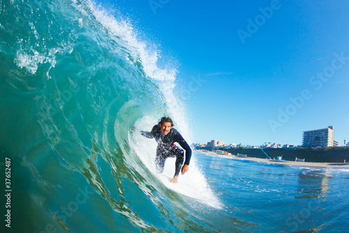 Surfer On Blue Ocean Wave