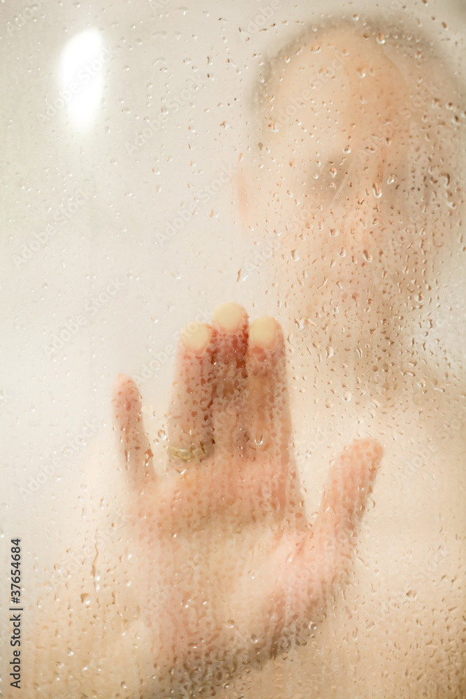 Fototapeta premium Man taking shower