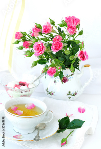 Rose bouquet and cup of tea