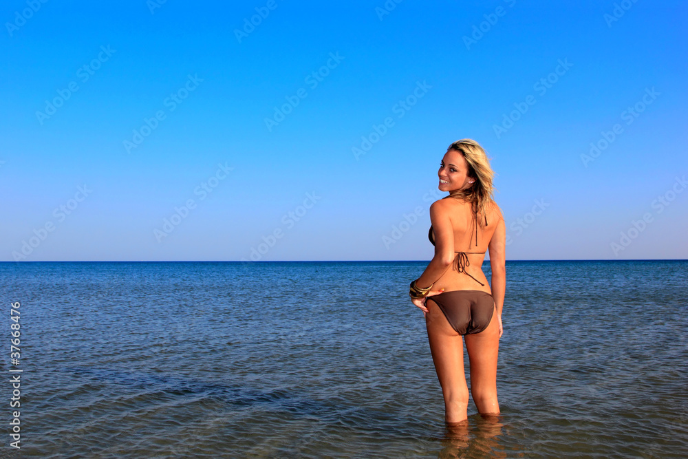 Fototapeta premium The beautiful bikini model posing