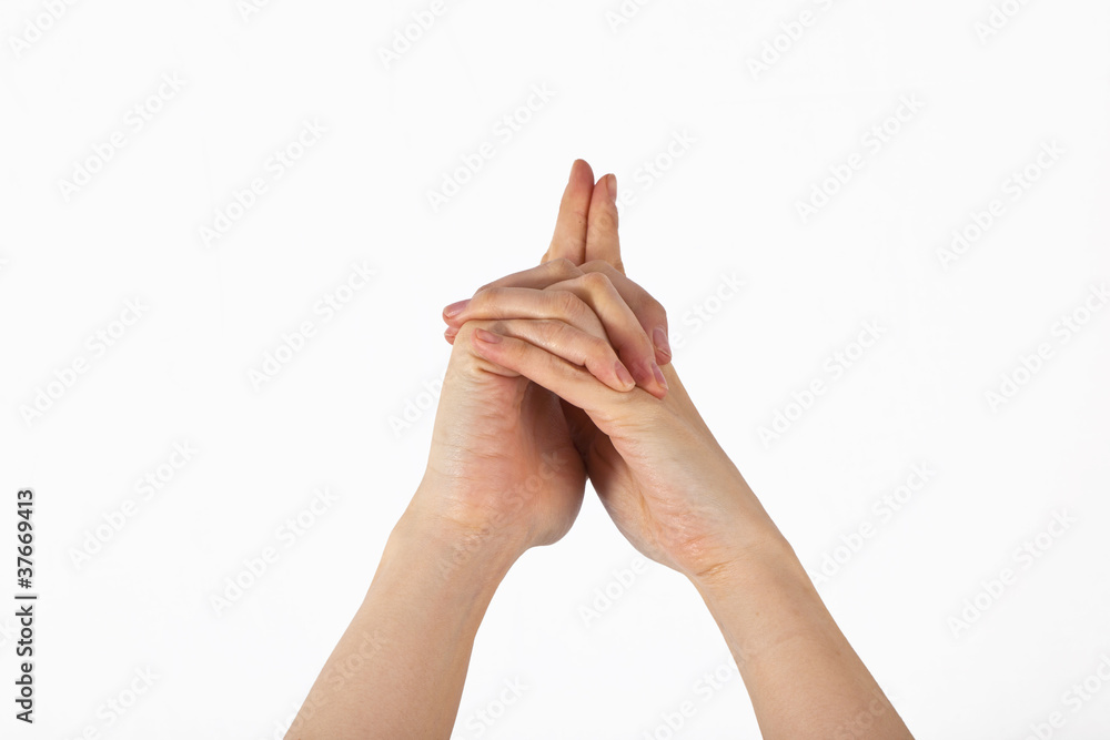 A womans hand is shown in yoga gesture