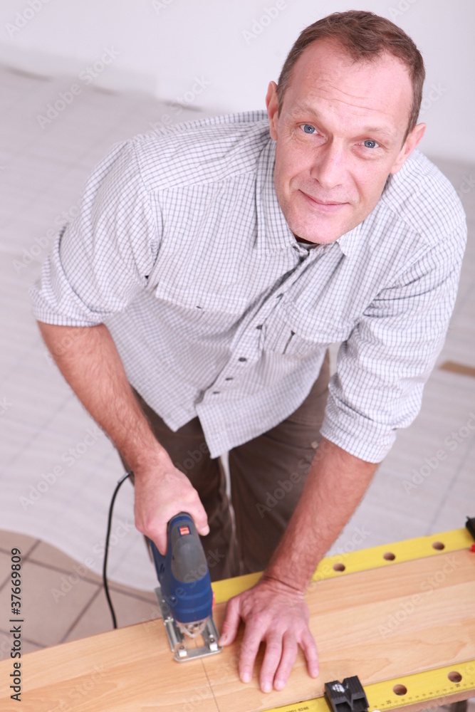 Man using a jigsaw Man using a jigsaw