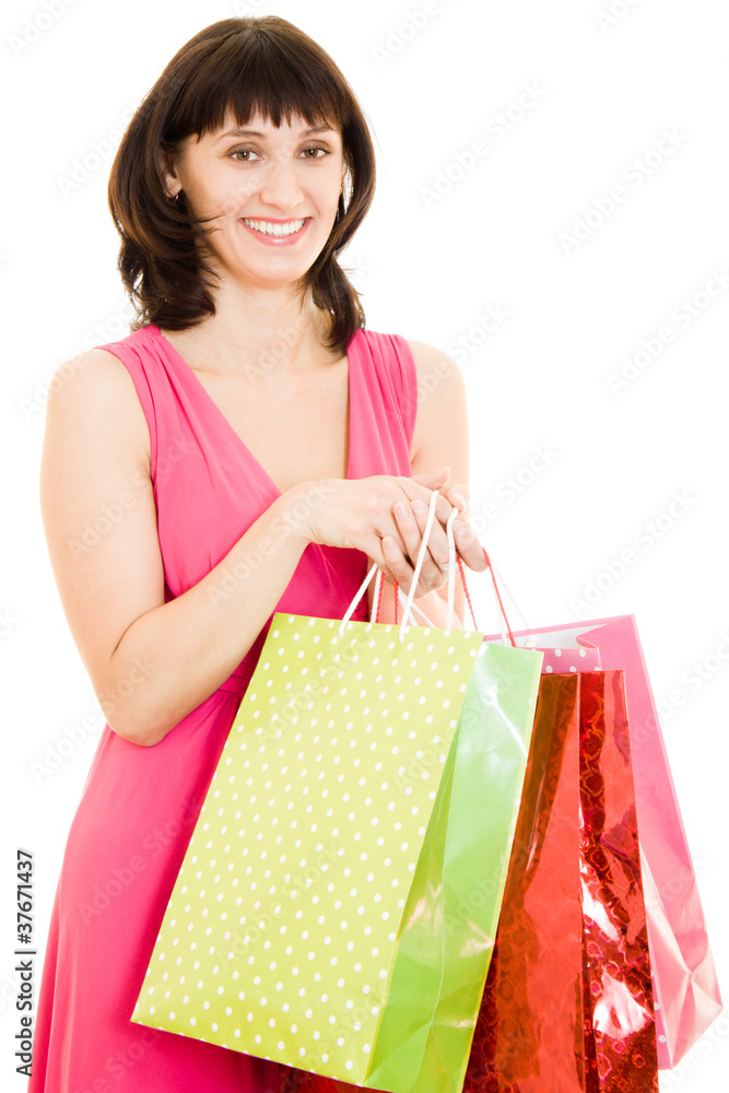 Girl with shopping in the red dress on white background.