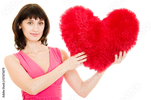 A woman holds a heart in his hands on a white background. © Sergey Khamidulin