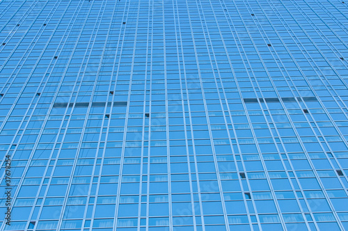 Modern skyscraper made of glass close up
