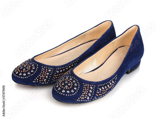 Elegant blue flat shoes for women in stones isolated on white