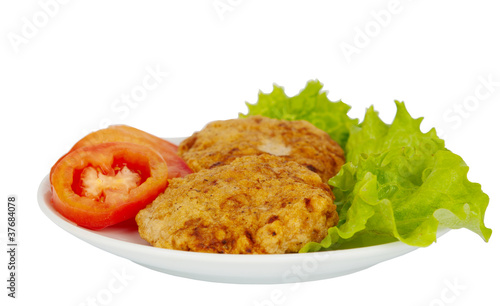 patties on a plate with lettuce leaves