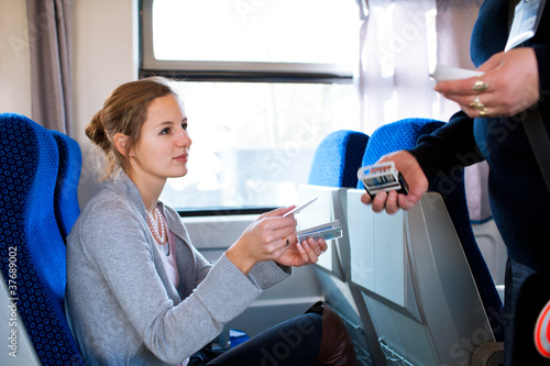 Bilde på lerret woman having her ticket checked by the conductor