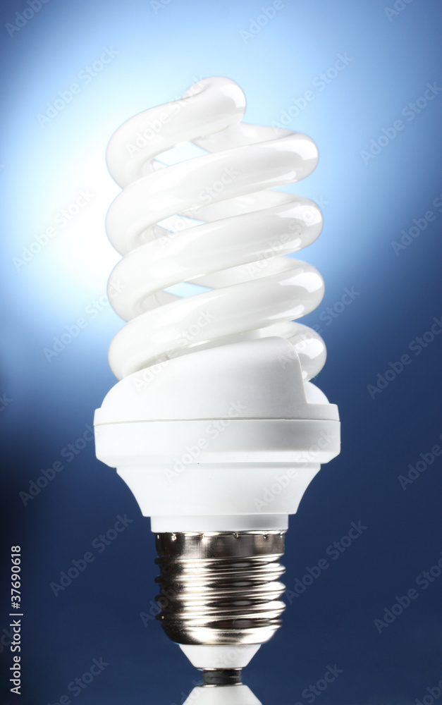 Energy saving lamp on blue background Energy saving lamp on blue background