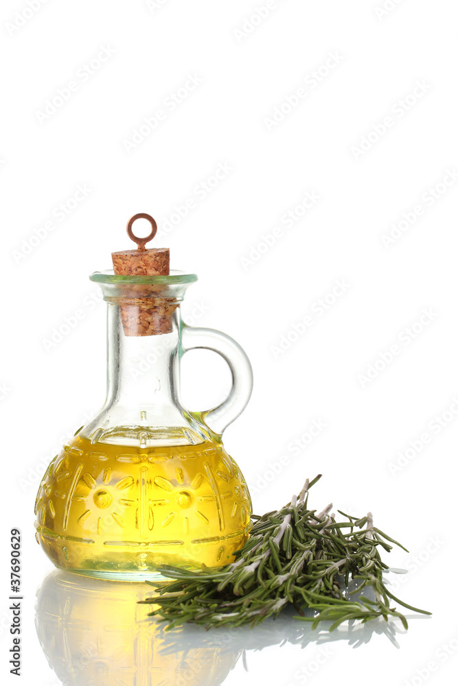 Oil in a bottle and fresh rosemary isolated on white Oil in a bottle and fresh rosemary isolated on white